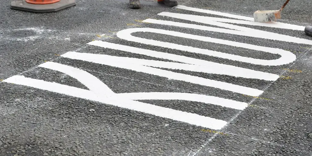Road workers mark